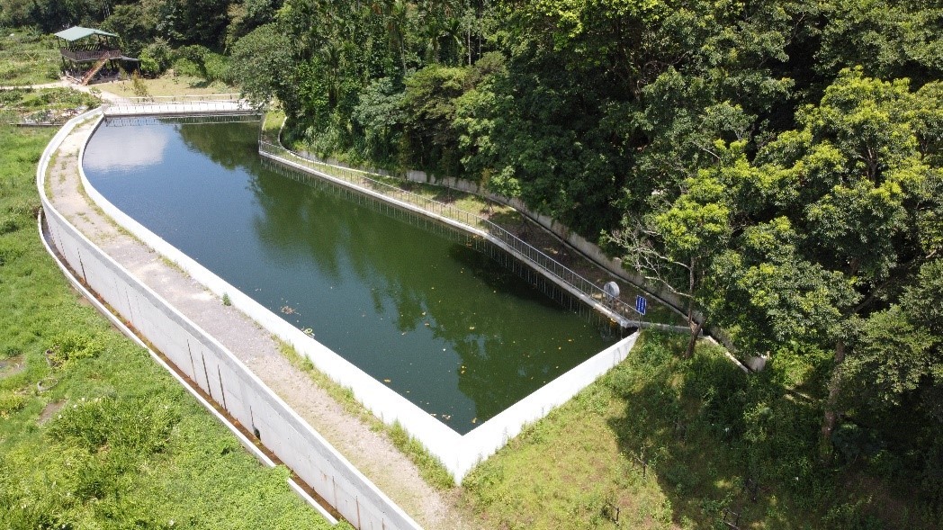 Aerial shot of a water storage farm pond