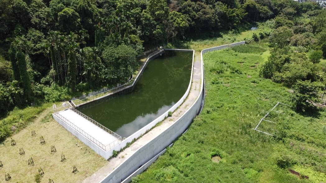 Aerial shot of a water storage farm pond