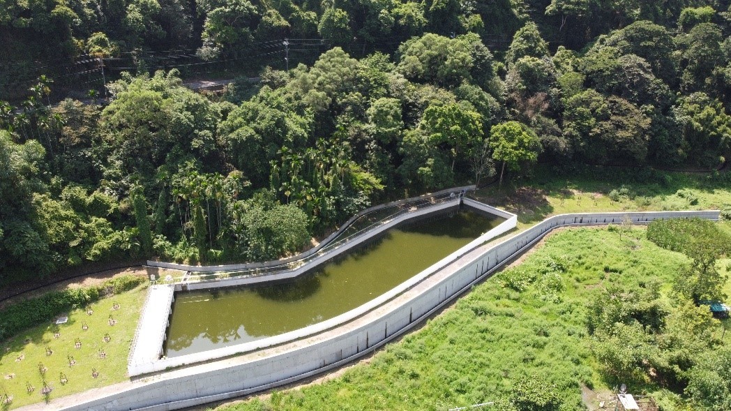 Aerial shot of a water storage farm pond